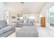 Open living area with neutral tones, a ceiling fan, and views of the outdoors at 3929 Cape Haze Dr # 101, Rotonda West, FL 33947