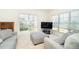 Bright living room featuring plush seating and natural light from large windows at 3929 Cape Haze Dr # 101, Rotonda West, FL 33947