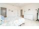 The main bedroom features a white dresser and view into the bathroom at 3929 Cape Haze Dr # 101, Rotonda West, FL 33947