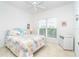 The main bedroom features coastal themed decor, white furniture and a ceiling fan at 3929 Cape Haze Dr # 101, Rotonda West, FL 33947