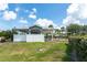 Community pool with surrounding fence, a covered picnic area, and blue skies above at 3929 Cape Haze Dr # 101, Rotonda West, FL 33947