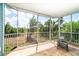 Enclosed screened porch offering outdoor living with views of lush greenery at 3929 Cape Haze Dr # 101, Rotonda West, FL 33947