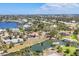 A scenic aerial view of the canal front homesite with dock, waterfront, and lush greenery at 500 Green Dolphin S Dr, Placida, FL 33946