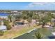 Wide aerial view of a home with pool and dock, nestled amidst lush greenery and waterways at 500 Green Dolphin S Dr, Placida, FL 33946