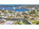 Aerial view of the canal front property with dock, waterfront homes, and lush greenery at 500 Green Dolphin S Dr, Placida, FL 33946