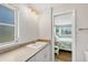Bright bathroom with sink and view into bedroom at 500 Green Dolphin S Dr, Placida, FL 33946