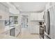 Modern kitchen with stainless steel appliances, white cabinetry and quartz countertops at 500 Green Dolphin S Dr, Placida, FL 33946
