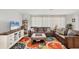 Bright living room with comfortable seating, an area rug, and an entertainment center at 500 Green Dolphin S Dr, Placida, FL 33946
