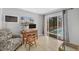 Comfortable living room with pool view, desk, and natural light at 500 Green Dolphin S Dr, Placida, FL 33946