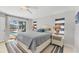 Bright main bedroom with pool view, nautical decor and neutral palette creating relaxing space at 500 Green Dolphin S Dr, Placida, FL 33946