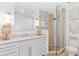 This bright bathroom is equipped with a glass shower and granite countertops at 5000 Gasparilla Rd # 8B, Boca Grande, FL 33921