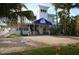 The property's exterior has lush tropical landscaping and elegant entrance at 5000 Gasparilla Rd # 8B, Boca Grande, FL 33921