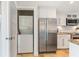 Bright kitchen with white cabinets, stainless appliances, and a washer and dryer at 5000 Gasparilla Rd # 8B, Boca Grande, FL 33921