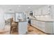 Open kitchen with granite countertops, stainless steel appliances, and views into the living room at 5000 Gasparilla Rd # 8B, Boca Grande, FL 33921
