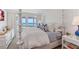 This primary bedroom features a lovely ocean view, decor and light-colored furnishings at 5000 Gasparilla Rd # 8B, Boca Grande, FL 33921
