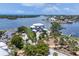 Panoramic aerial view of a stunning waterfront estate surrounded by lush greenery and picturesque waterways at 565 Green Dolphin S Dr, Placida, FL 33946