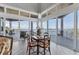 Open dining area with expansive windows offering beautiful waterfront views at 565 Green Dolphin S Dr, Placida, FL 33946