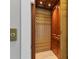 A residential elevator features a wood interior and an accordion gate at 565 Green Dolphin S Dr, Placida, FL 33946