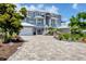 Spacious home with a large driveway and ample parking space, perfect for Gathering and guests at 565 Green Dolphin S Dr, Placida, FL 33946