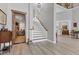 Inviting foyer with a staircase and an open doorway leading to a wine cellar at 565 Green Dolphin S Dr, Placida, FL 33946