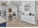 Spacious kitchen featuring custom cabinetry, open shelving, and wood-look tile flooring at 565 Green Dolphin S Dr, Placida, FL 33946