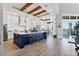 Gourmet kitchen featuring an island with counter seating, a bay window, and wood ceiling beams at 565 Green Dolphin S Dr, Placida, FL 33946