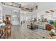 Open living room featuring the second-floor balcony, two-story ceiling, and an adjacent kitchen at 565 Green Dolphin S Dr, Placida, FL 33946