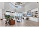 Bright living room featuring water views, clerestory windows, built-in shelving, and neutral decor at 565 Green Dolphin S Dr, Placida, FL 33946