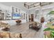 Open living room with two-story ceiling, clerestory windows, built-in shelving, and neutral decor at 565 Green Dolphin S Dr, Placida, FL 33946