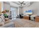 Spacious living room with ample seating, a large TV, and access to a balcony at 565 Green Dolphin S Dr, Placida, FL 33946