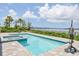 Backyard pool and jacuzzi combo featuring serene waterfront views at 565 Green Dolphin S Dr, Placida, FL 33946