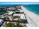 Aerial view of beachside condos, showcasing breathtaking ocean and bay views, plus beach access for coastal living at 5700 Gulf Shores Dr # B-137, Boca Grande, FL 33921