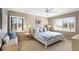 This spacious bedroom is illuminated by natural light, complemented by coastal decor and a comfortable seating area at 5700 Gulf Shores Dr # B-137, Boca Grande, FL 33921