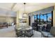 Bright dining area with beach views, round glass table, and seating for four at 5700 Gulf Shores Dr # B-137, Boca Grande, FL 33921