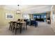 Charming dining and living area with neutral carpet, comfortable seating, and ocean view at 5700 Gulf Shores Dr # B-137, Boca Grande, FL 33921