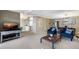 Spacious living room with open floor plan, comfortable seating, and a view of the dining area at 5700 Gulf Shores Dr # B-137, Boca Grande, FL 33921