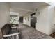 Condo lobby featuring a bench, textured walls, tile flooring, elevator, and access to the parking garage at 5700 Gulf Shores Dr # B-137, Boca Grande, FL 33921