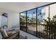 Relaxing outdoor patio with beach views, outdoor furniture, a lush garden, and blue skies at 5700 Gulf Shores Dr # B-137, Boca Grande, FL 33921