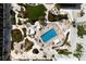 Aerial view of a resort-style swimming pool and lush landscaping, for premium outdoor living at 5700 Gulf Shores Dr # B-137, Boca Grande, FL 33921