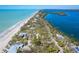 Charming beach home nestled among lush foliage with beach and bay access at 6430 Manasota Key Rd, Englewood, FL 34223
