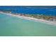 Beach home located on sandy shore, surrounded by lush greenery and beautiful turquoise waters at 6430 Manasota Key Rd, Englewood, FL 34223