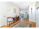 Warm entryway with hardwood floors, decor, and a glimpse into the bright living room at 6430 Manasota Key Rd, Englewood, FL 34223