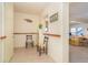 Inviting entryway with charming coastal decor and seamless access to the adjacent living area at 6430 Manasota Key Rd, Englewood, FL 34223