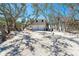 Beautiful two-story home featuring a two-car garage, neutral paint, and lots of trees at 6430 Manasota Key Rd, Englewood, FL 34223
