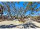The house is surrounded by lush trees and well-maintained landscaping, enhancing curb appeal at 6430 Manasota Key Rd, Englewood, FL 34223