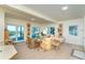 Bright living room with access to the outdoors, offering beautiful views and comfortable seating at 6430 Manasota Key Rd, Englewood, FL 34223
