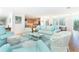 Spacious living room with comfortable furniture and an open floor plan to the kitchen at 6430 Manasota Key Rd, Englewood, FL 34223