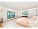 Bright main bedroom features beautiful ocean view, neutral decor, and a desk at 6430 Manasota Key Rd, Englewood, FL 34223
