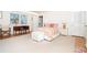 Bright main bedroom with wood floors, decorative bedside tables, and a desk at 6430 Manasota Key Rd, Englewood, FL 34223