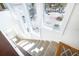 Bright upper staircase with white walls and plush carpeting leading to the upper level at 6430 Manasota Key Rd, Englewood, FL 34223